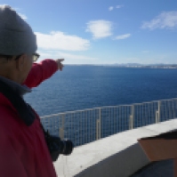Hubby is pointing at our apartment building across the bay